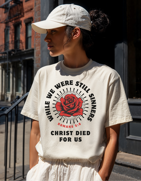 WHILE WE WERE STILL SINNERS GRAPHIC UNISEX T-SHIRT